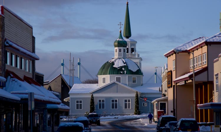 Downtown Sitka with St. Michael's Cathedral showcased and Sitka's John O'Connell Bridge in the background.